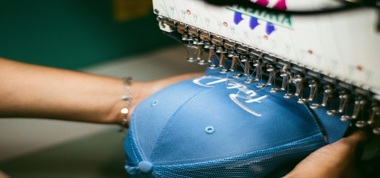 a person creating 3D Puff Embroidery on hat